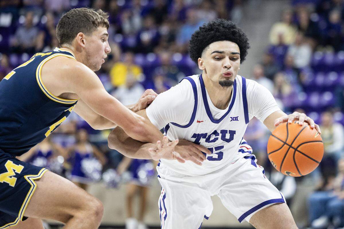 TCU forward David Punch (15) is guarded on the perimetert in the first half of a NCAA basketball game between the TCU Horned Frogs and the Michigan Wolverines at Schollmaier Arena in Fort Worth on Friday, Nov.14, 2025.