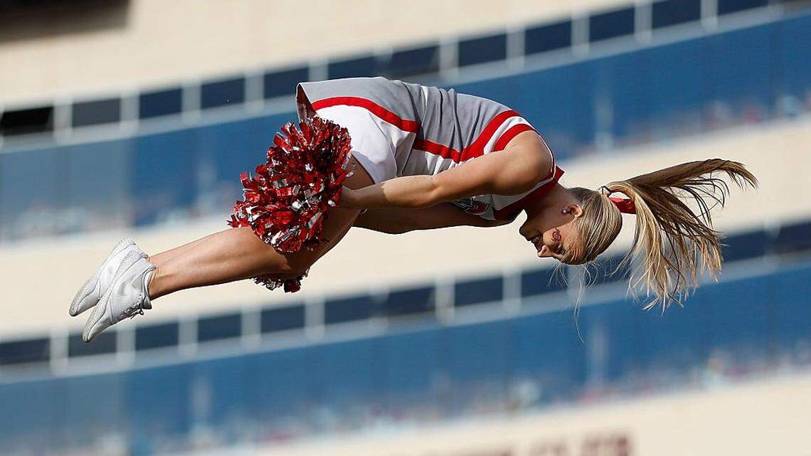 MADISON, WISCONSIN - OCTOBER 18: Ohio State Buckeyes cheerleader entertains crowd during the game against the Wisconsin Badgers at Camp Randall Stadium on October 18, 2025 in Madison, Wisconsin. (Photo by John Fisher/Getty Images)