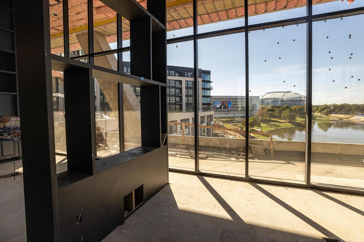 The inside of the resident bar and lounge with views of AT&T Stadium at the One Rangers Way residential apartment complex in the Arlington Entertainment District on Tuesday, Nov. 12, 2024.