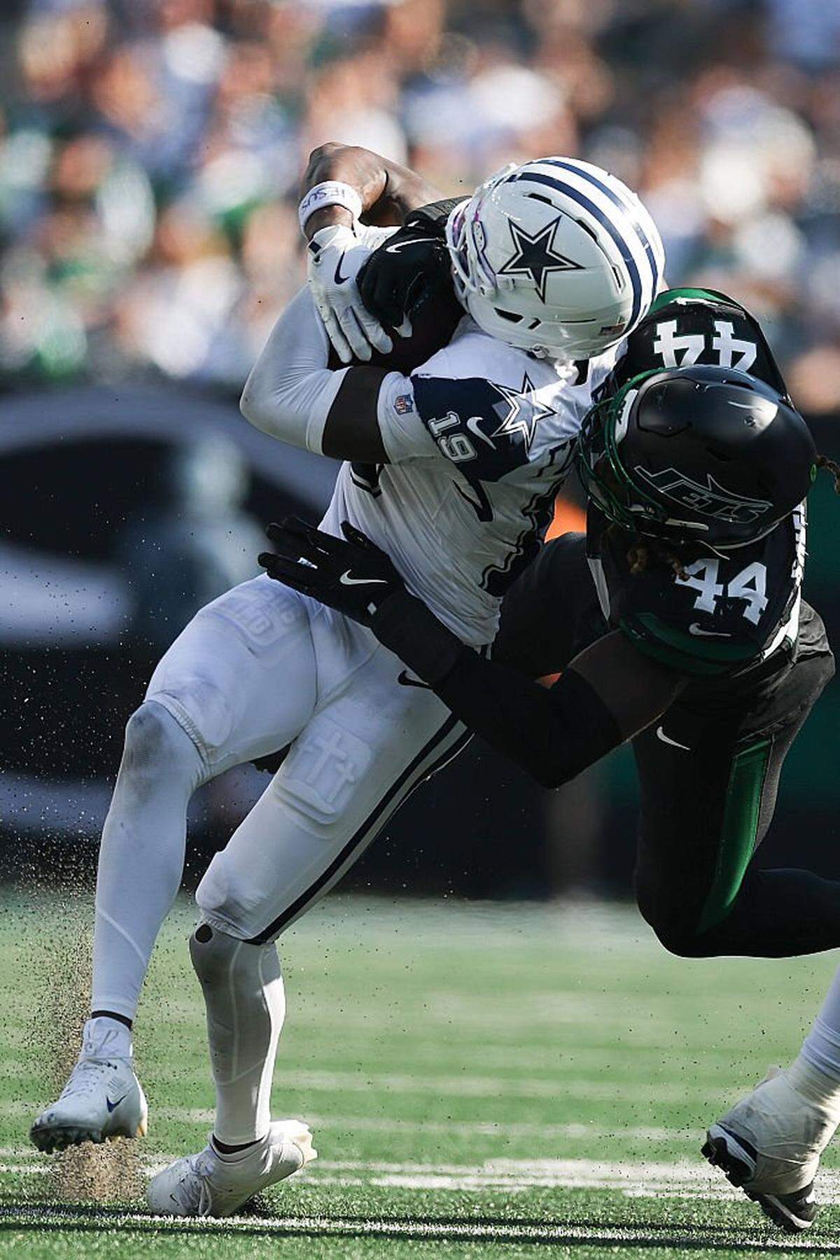 EAST RUTHERFORD, NEW JERSEY - OCTOBER 05: Ryan Flournoy #19 of the Dallas Cowboys is tackled by Jamien Sherwood #44 of the New York Jets in the game at MetLife Stadium on October 05, 2025 in East Rutherford, New Jersey. (Photo by Ishika Samant/Getty Images)