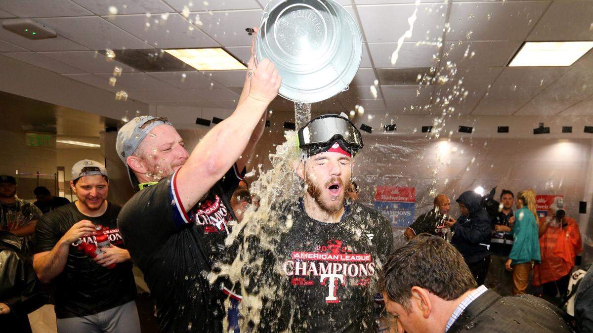 Texas Rangers players celebrate Monday after winning game seven in the American League Championship Series against the Houston Astros for the 2023 MLB playoffs at Minute Maid Park. (Thomas Shea-USA TODAY Sports)