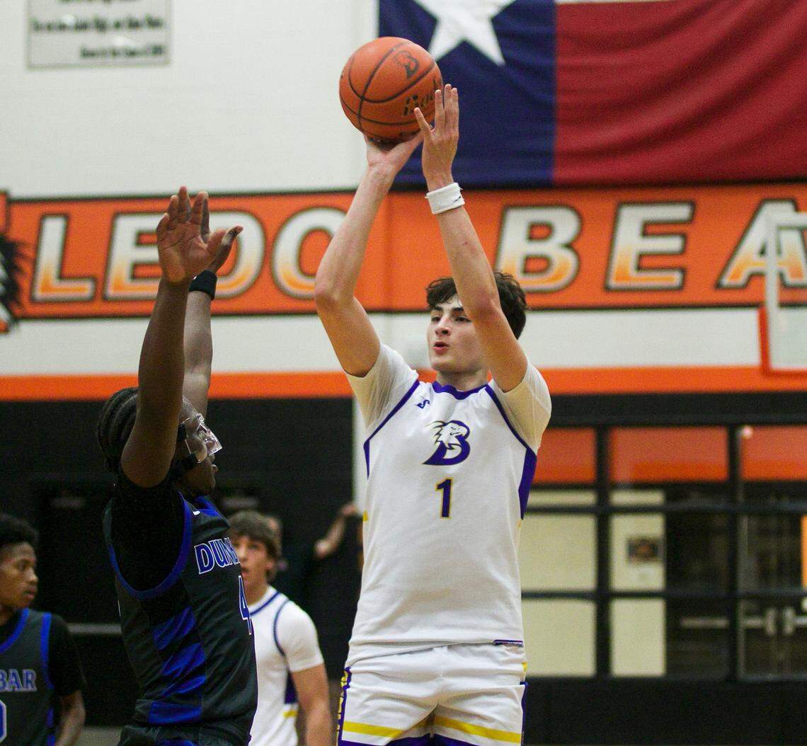 Brock’s Eli Paez (1) shoots over Fort Worth Dunbar’s Dreyon Crear (4) in a Class 4A Division II area-round playoff game on Thursday, February 26, 2026 at Aledo High School in Aledo, Texas.
