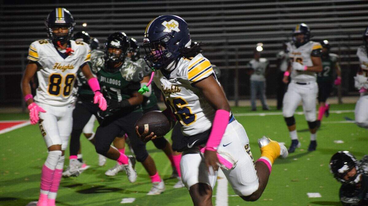 Fort Worth Arlington Heights’ Kahleb Adams (16) on a touchdown run in the fourth quarter of a high school football game against Fort Worth Trimble Tech at Scarborough-Handley Field in Fort Worth, Texas Thursday, October 24, 2024.