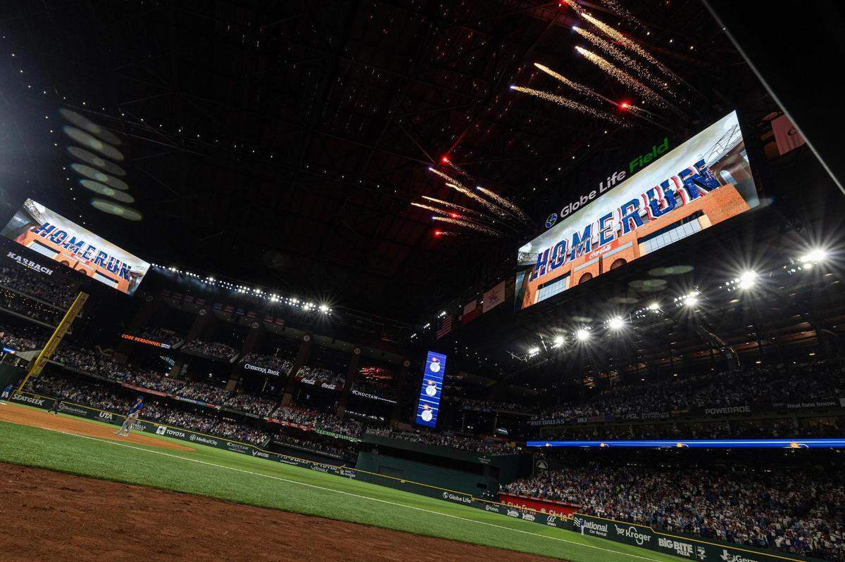 Fireworks go off after Rangers outfielder Adolis Garcia (53) hits the Rangers first home run of the season in the sixth inning of the season opener against the Chicago Cubs at Globe Life Field in Arlington on Thursday, March 28, 2024.