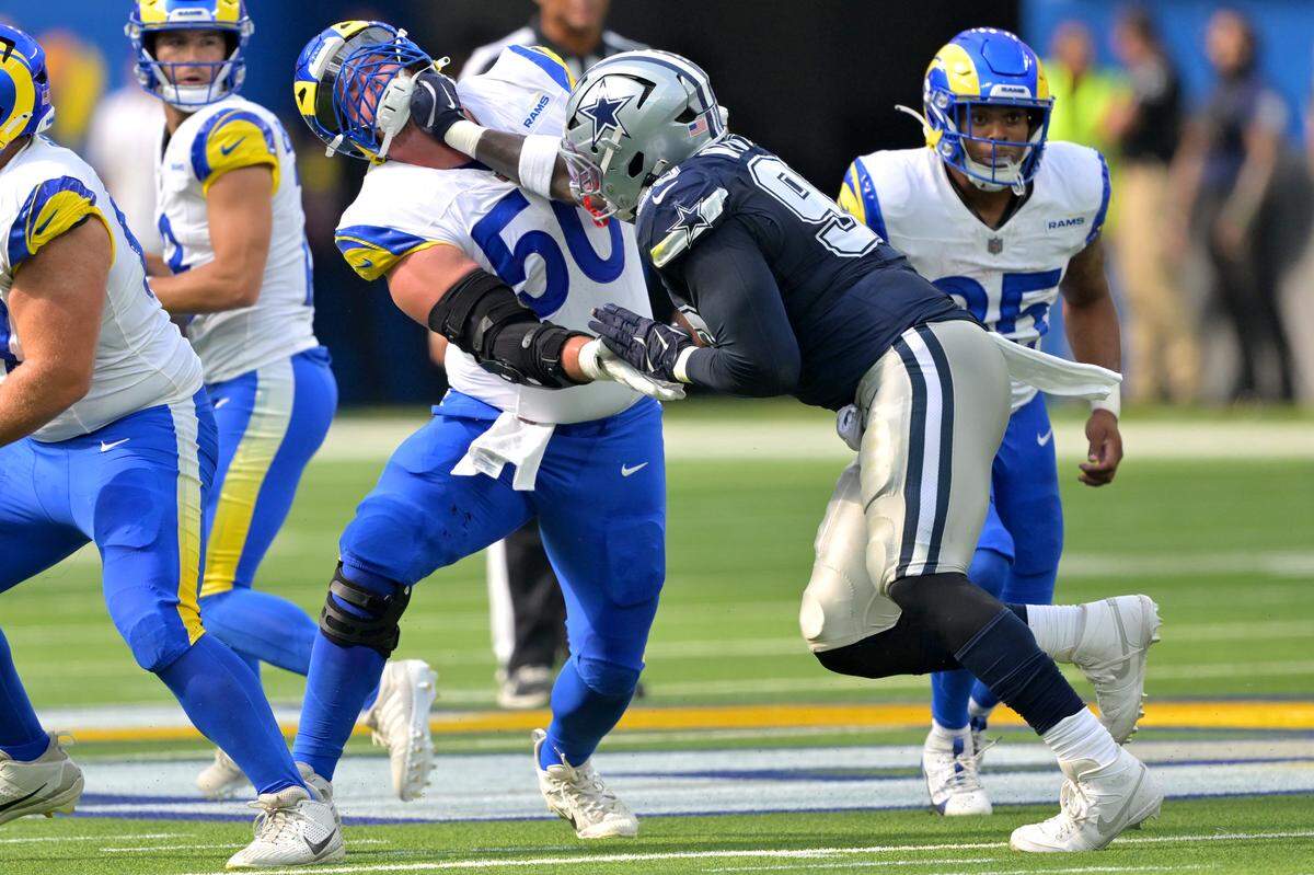 Dallas Cowboys defensive tackle Perrion Winfrey (right) battles Los Angeles Rams center Beaux Limmer during a preseason game Aug. 9 in Inglewood, Calif.