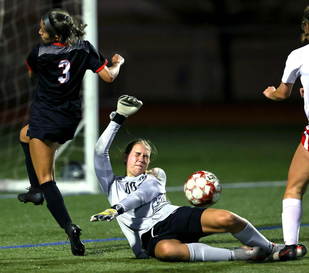 Grapevine goaltender Ashley Knight (00) makes a save on Mansfield Legacy’s Camryn Gonzales (3) during the first half of the 5A Region 1 area round girls soccer playoffs played on March 30 2021, at Cravens Field in Arlington, TX. (Steve Nurenberg Special to the Star-Telegram)
