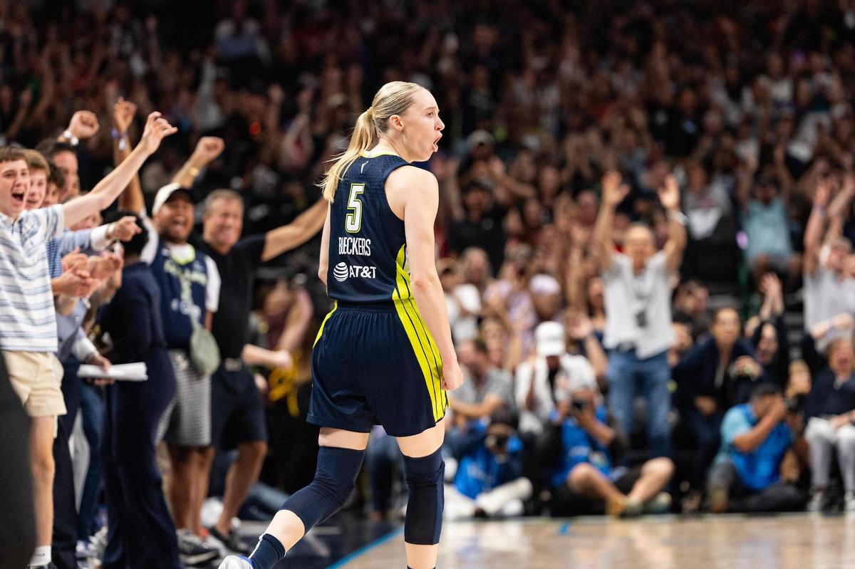 Dallas Wings guard Paige Bueckers (5) reacts after hitting a three-point shot at the halftime buzzer of a WNBA game between the Dallas Wings and Indiana Fever at the American Airlines Center in Dallas on Friday, June 27, 2025.
