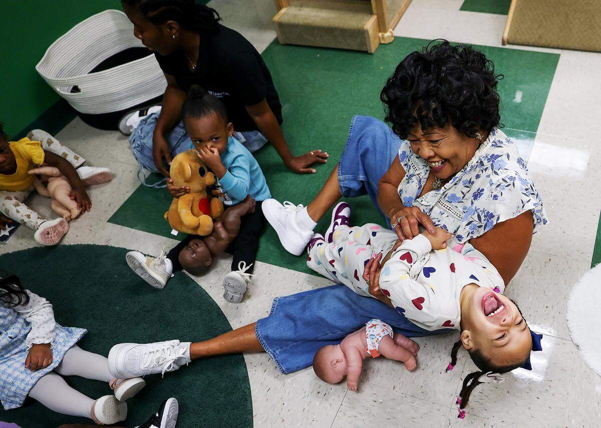 Wanda Fields, 75,  interacts with children at the Early Head Start program at J.A. Hargrave Elementary School on Monday, Sept. 15, 2025, in Fort Worth. Fields spends 20 hours a week volunteering through the Texas Health and Human Services' Foster Grandparent program. 