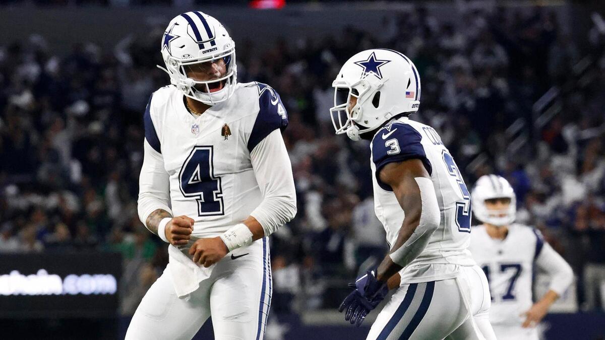 Dallas Cowboys quarterback Dak Prescott with teammate Brandin Cooks after scoring a touchdown in the second quarter on Sunday, December 10, 2023, at AT&T Stadium in Arlington.