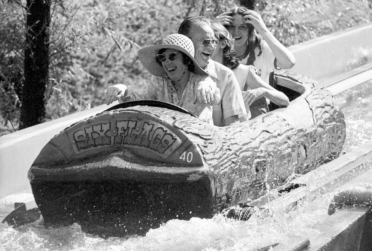 June 27, 1980: A family cools off in the log flume ride at Six Flags in Arlington during a heat wave across North Texas and Fort Worth.