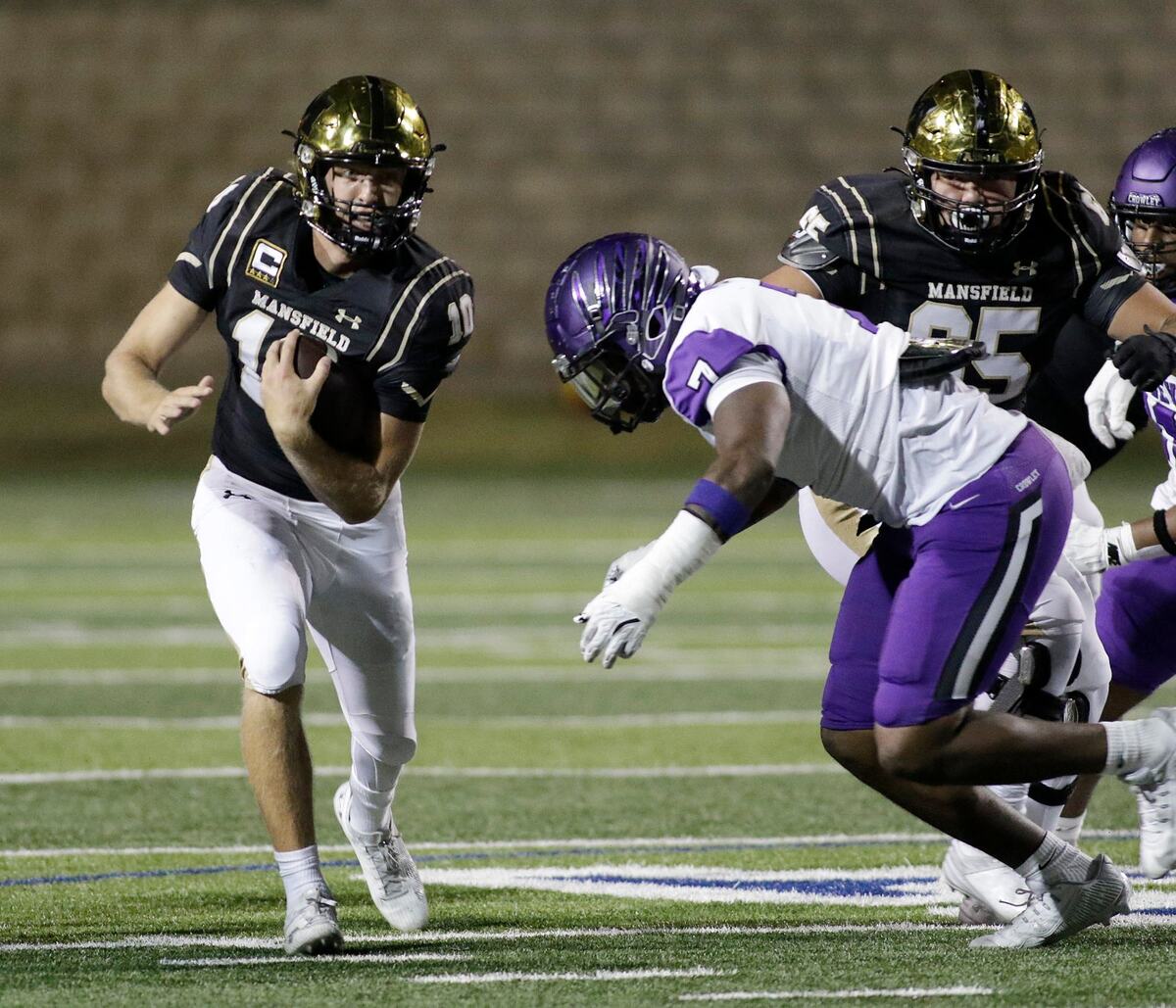 Mansfield’s Braxton Van Cleave tries to escape the tackle of Crowley’s Keshawn Morris during a UIL football game at Newsome Stadium on Saturday , October 10, 2024.