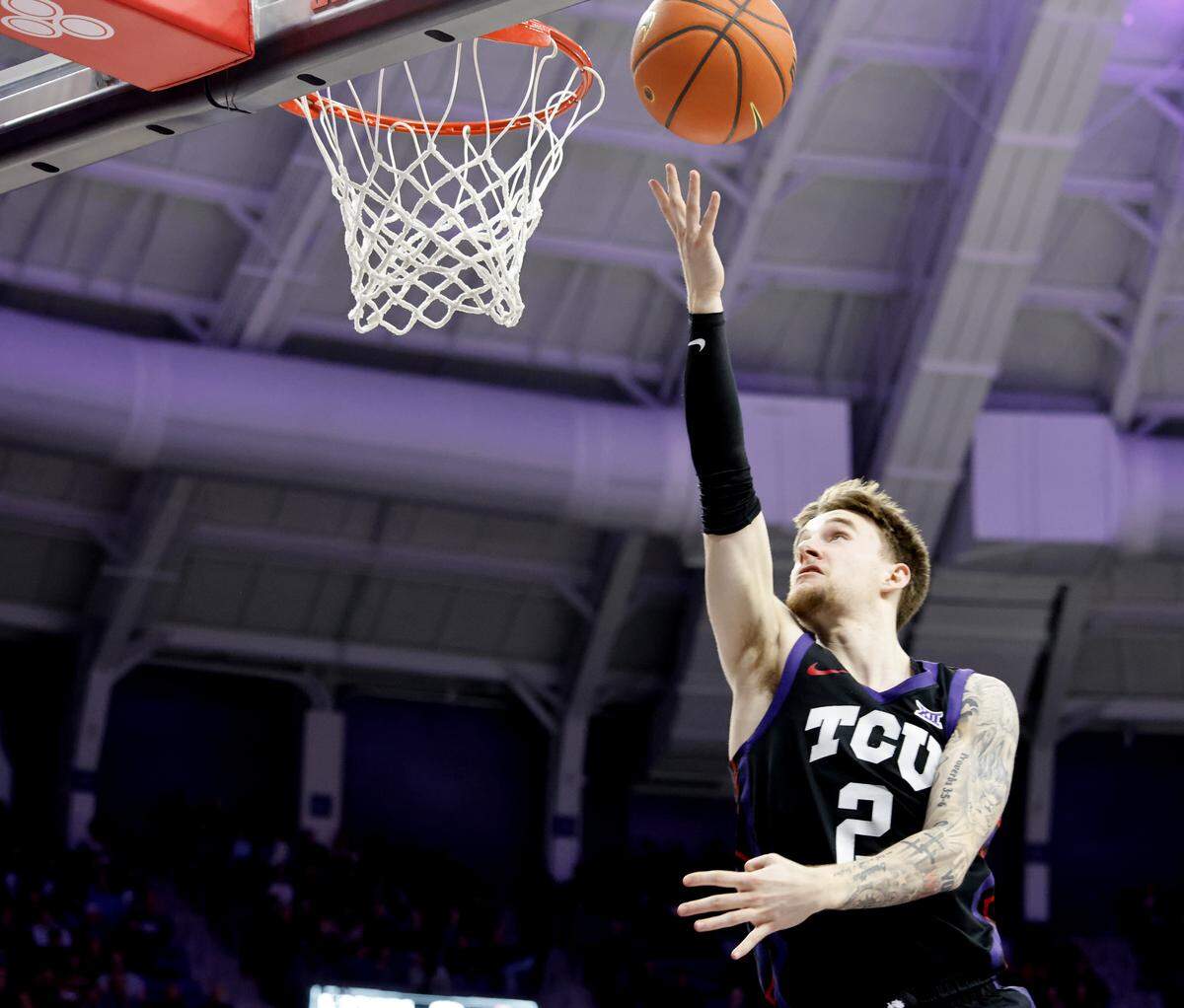 TCU guard Brock Harding (2) puts In an easy two against Houston during the first half of a NCAA basketball game between the University of Houston and TCU at Schollmaier Arena in Fort Worth, Texas, Wednesday Jan. 26, 2026