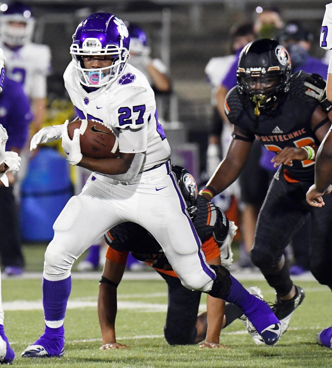 Paschal’s Chris Gee takes the football as the Polytechnic defense comes in for the tackle in the fourth quarter of their football game Thursday, October 8, 2020 at Clark Stadium in Fort Worth, Texas. Special/Bob Haynes