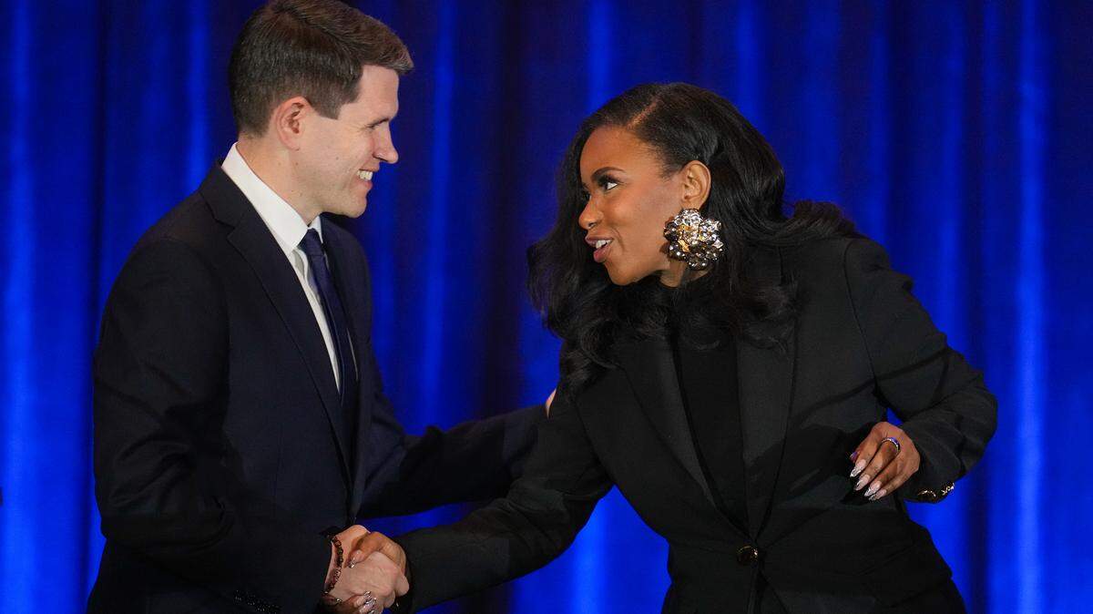 State Rep. James Talarico, left, and U.S. Rep. Jasmine Crockett, Democratic primary candidates for U.S. Senate, shake hands prior to a debate at the Texas AFL-CIO COPE Convention in Georgetown, Texas on Saturday, Jan. 24, 2026.