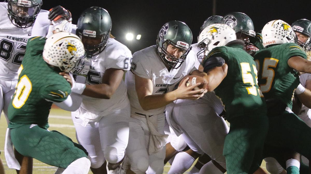 Kennedale quarterback Evan Jowers (2) breaks through the line to put Kennedale up 15-0 after a two-point-conversion in the first half of a high school football game at Clark Stadium in Fort Worth, Texas, Thursday, Nov. 01, 2018. Kennedale led 29-7 at the half. (Special to the Star-Telegram Bob Booth)

