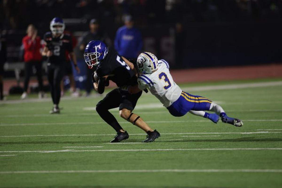 Graham wide receiver Harison Brockway (5) tries to shake the tackle of Brock’s Coty Farmer (3) on Friday, Nov. 1, 2024 at Newton Field in Graham, Texas.