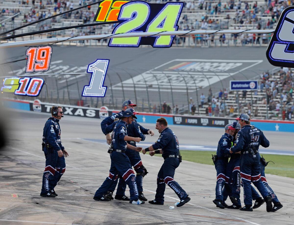 The crew for William Byron (24) celebrate on pit row after winning the Autotrader Echopark Automotive 400 NASCAR Cup Series Playoff Race at Texas Motor Speedway in Fort Worth, Texas, Sunday, Sept. 24, 2023. William Byron (24) won the race for Hendrick Motorsports. (Special to the Star-Telegram Bob Booth)