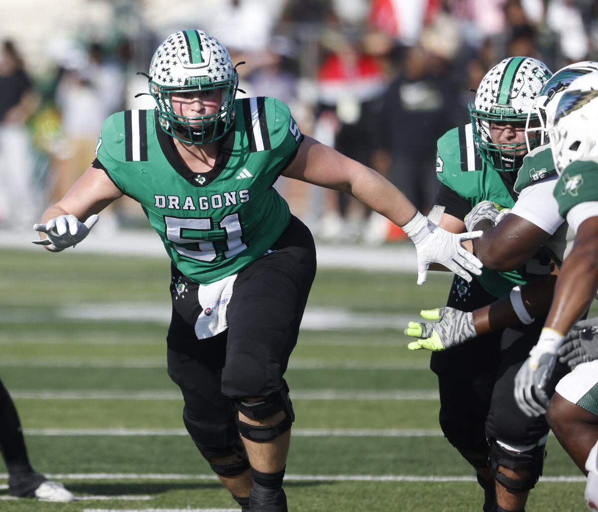 Southlake Carroll center Carey Clayton (51) looks for a block against DeSoto during the first half of a UIL Class 6A Division II semifinal on Saturday Dec. 13, 2025 at Vernon Newsom Stadium in Mansfield, Texas.