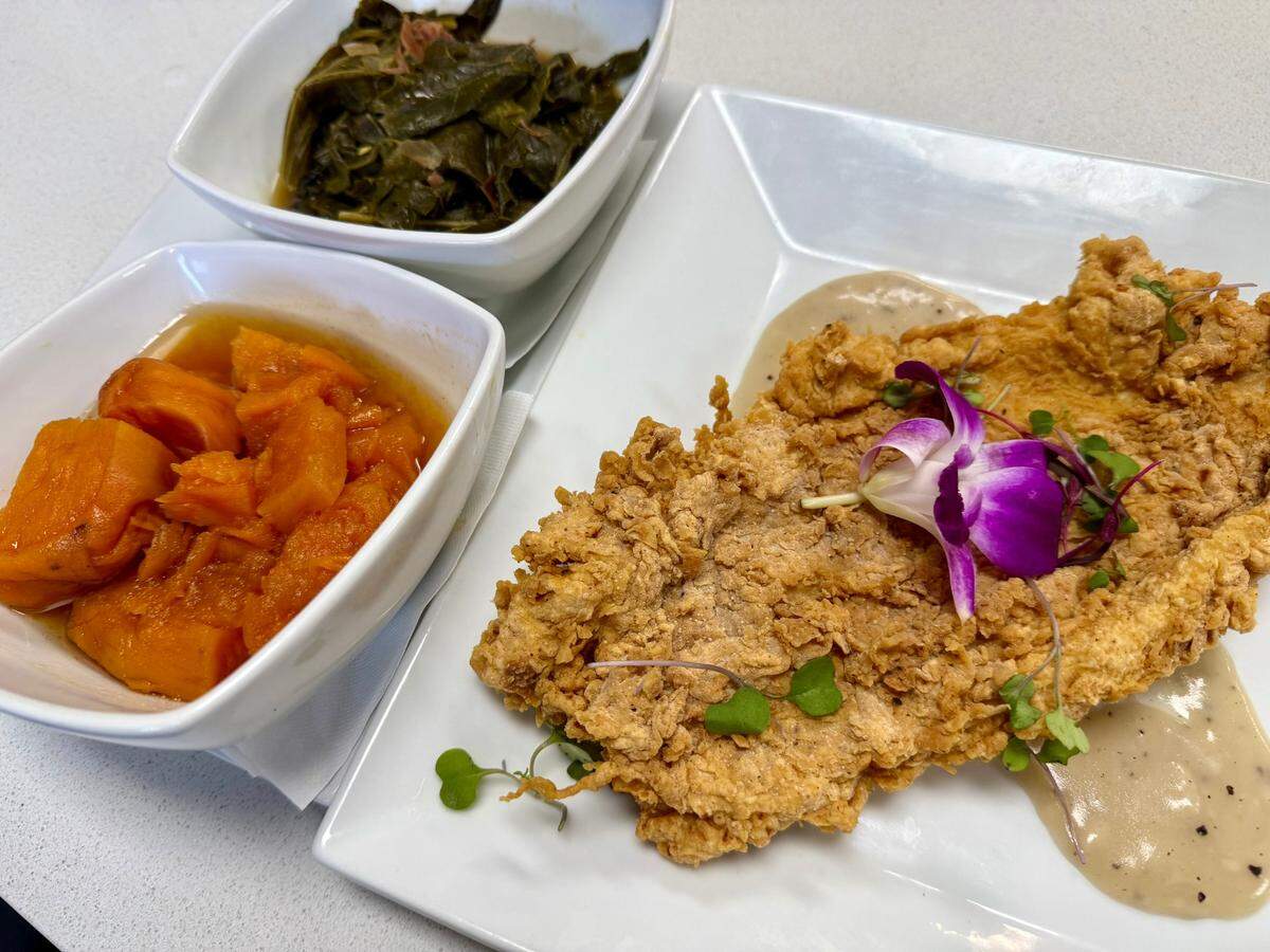 Chicken-fried chicken with yams and collards with smoked turkey at Chef’s Corner in Fort Worth, Texas, June 21, 2025.
