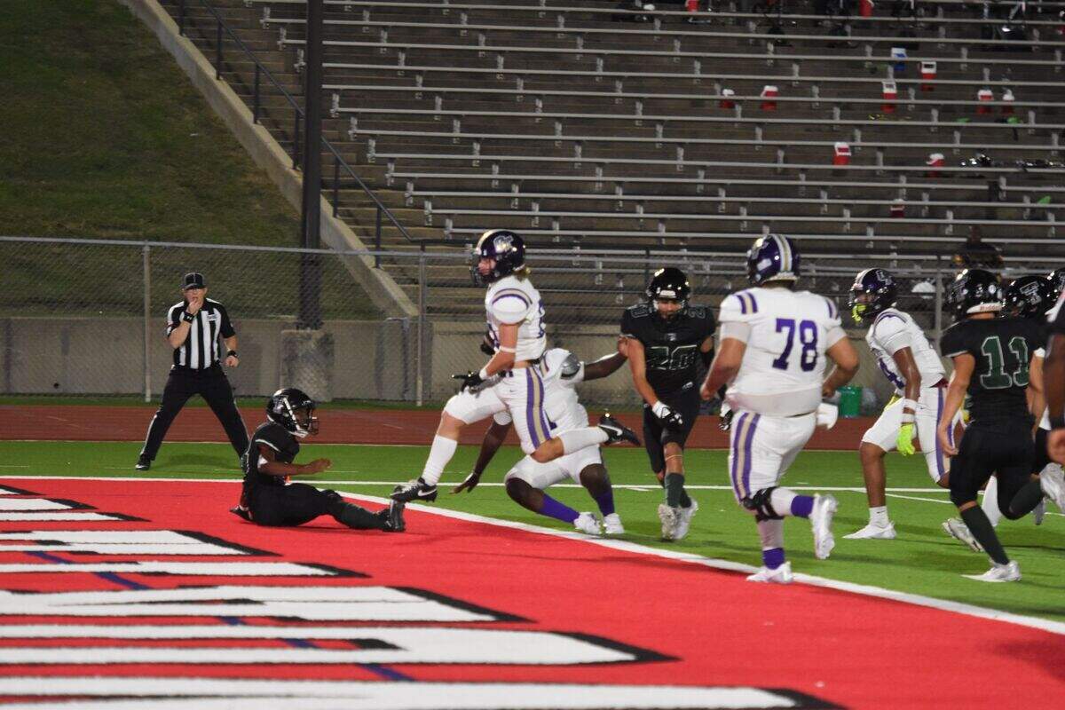 Chisholm Trail’s Ethan Westover (22) scores a touchdown against Trimble Tech during the third quarter of a high school football game at Clark Stadium in Fort Worth, Texas Thursday, September 19, 2024.