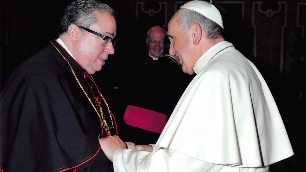 Bishop Michael Olson, shaking hands with Pope Francis, said the pope was very well informed” on the issues in the Diocese of Fort Worth.