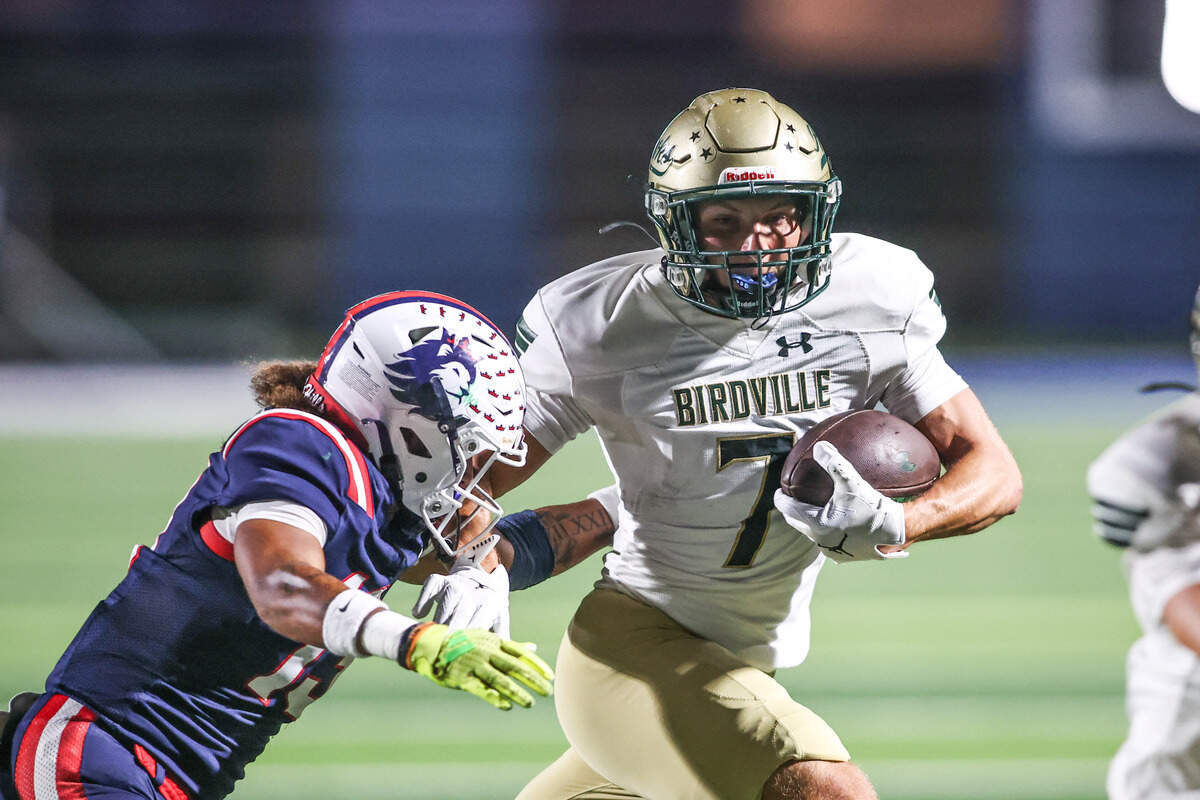 Birdville receiver Triston Spain is tackled by Richland’s Tristan Brookins in the Friday, Sept. 26, game at Birdville ISD FineArts/Athletics Complex.