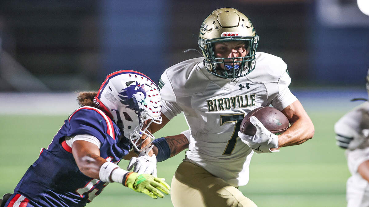 Birdville receiver Triston Spain is tackled by Richland’s Tristan Brookins on Sept. 26 at Birdville ISD FineArts/Athletics Complex.