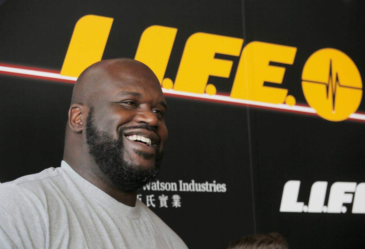 NBA star Shaquille O’Neal poses for photographers during a press conference to launch an energy drink in Hong Kong, Tuesday, Aug. 18, 2015. (AP Photo/Vincent Yu)