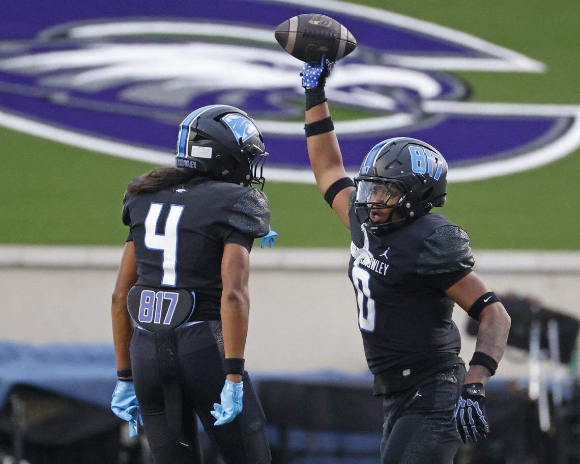 North Crowley linebacker Amaj Mitchell (0) displays the ball he recovered after a DeSoto muffed snap during the first half of a UIL football game between DeSoto and North Crowley at Crowley ISD Multi-Purpose Stadium in Fort Worth, Texas, Friday, Sept. 05, 2025.