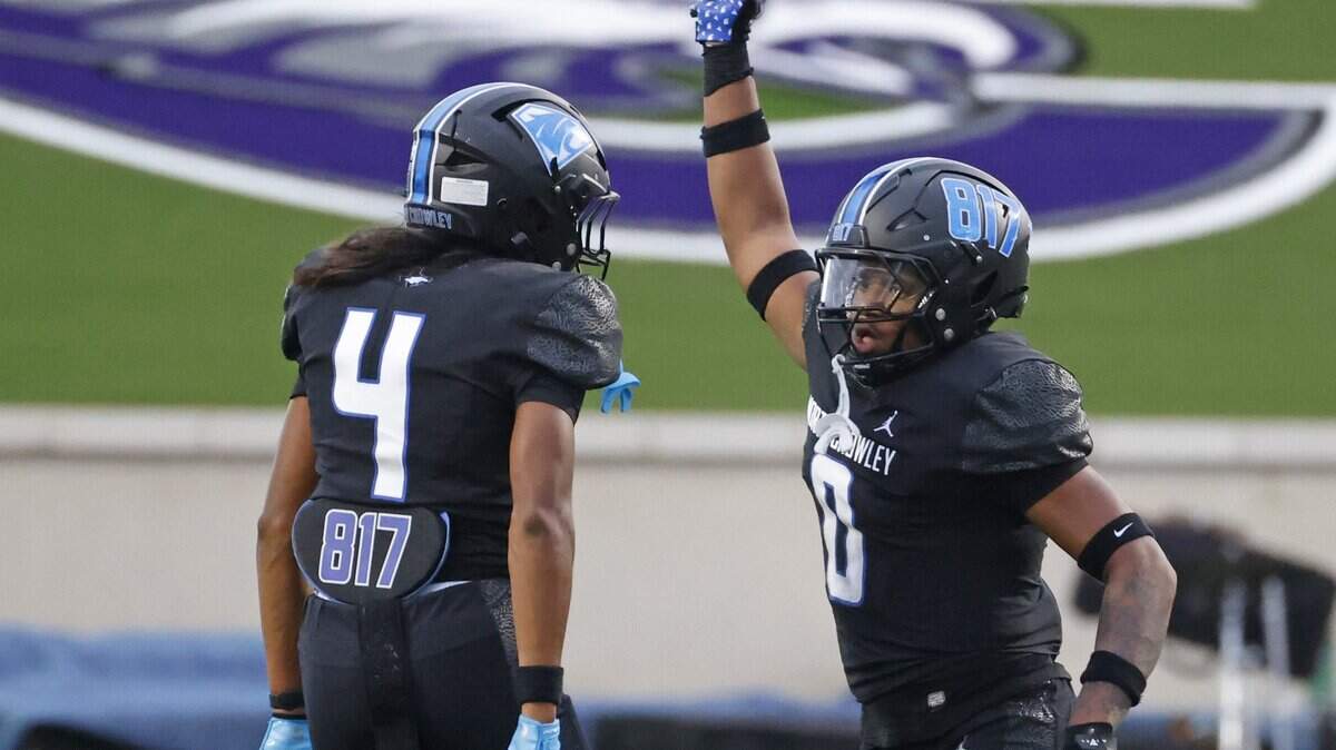 North Crowley linebacker Amaj Mitchell (0) displays the ball he recovered after a DeSoto muffed snap during the first half of a UIL football game between DeSoto and North Crowley at Crowley ISD Multi-Purpose Stadium in Fort Worth, Texas, Friday, Sept. 05, 2025.