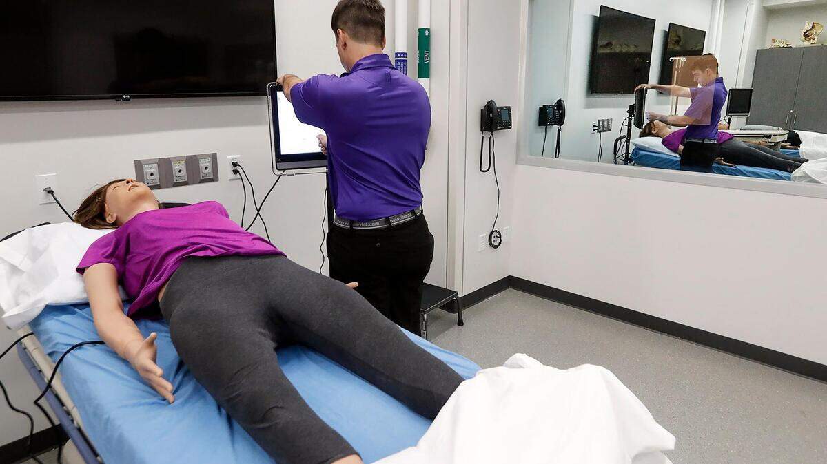 Corbin Santana, a mixed reality simulation specialist at the new TCU and UNTHSC School of Medicine in 2019, prepares a lab for the school’s inaugural class of medical students.