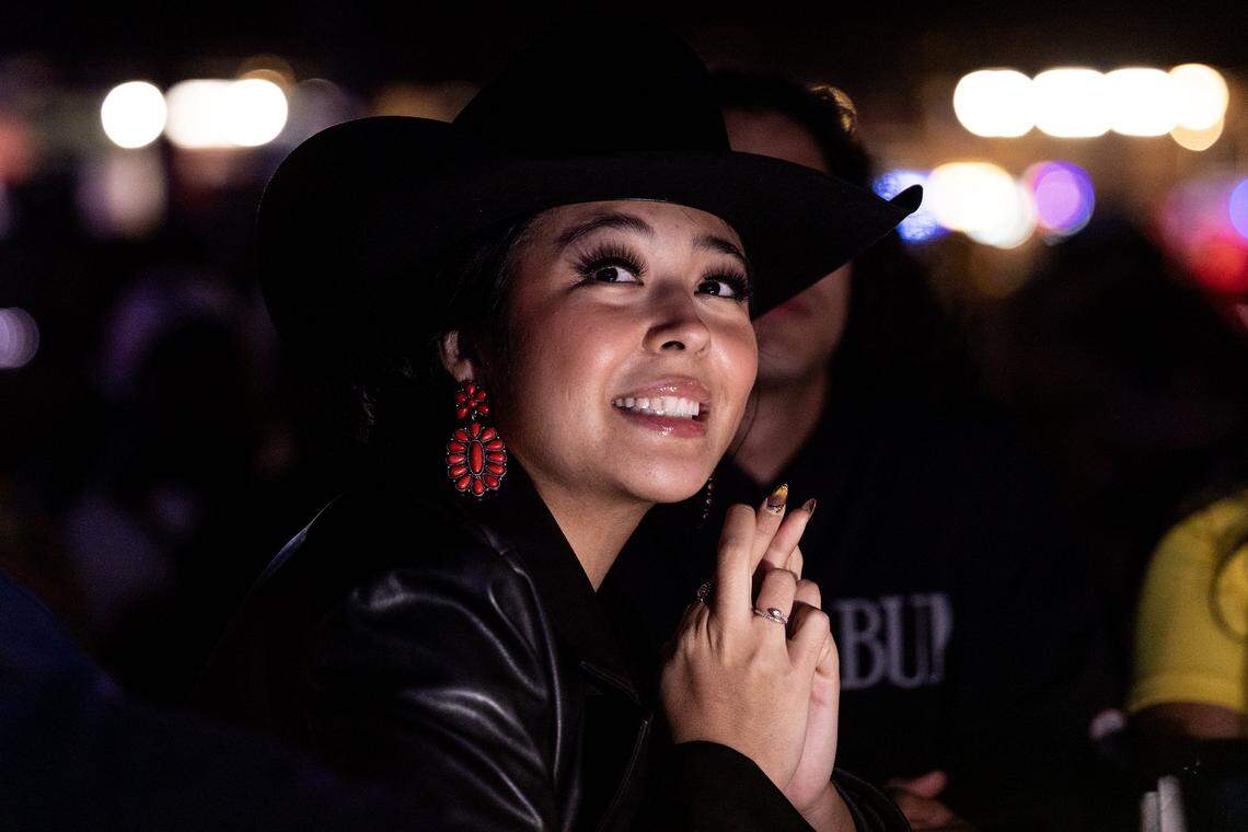 Dallas resident Paloma Diaz looks at the screen hoping Colombia gets picked Friday.