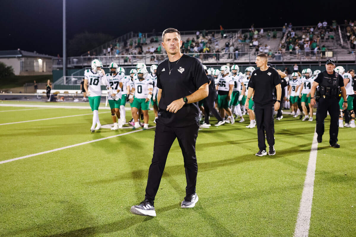 Southlake Carroll head coach Riley Dodge walks onto the field following a 55-13 win against Keller Timber Creek on Thursday, September 25, 2025 at Keller ISD Stadium in Keller, Texas.