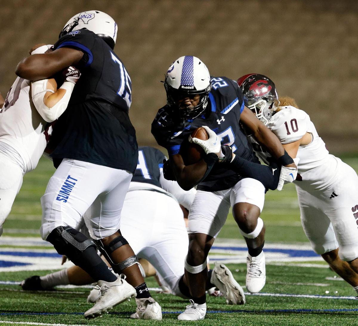 Summit’s Da’Vonte Johnson gets some yards up the middle in the second half of a UIL football game at Vernon Newsom Stadium in Mansfield, Texas, Friday, Nov. 03, 2023. Summit defeated Ennis 28-21. (Special to the Star-Telegram Bob Booth)