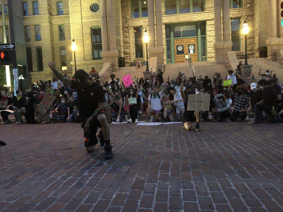 About 8:50 p.m. Tuesday, protesters who stayed out past curfew in downtown Fort Worth took a knee on the courthouse steps.