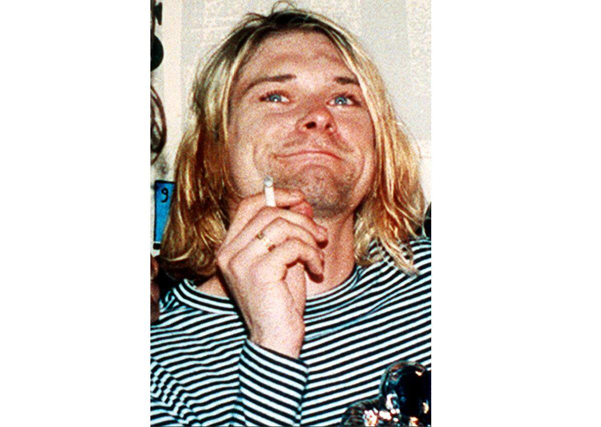 FILE - This 1993 file photo shows Kurt Cobain, the lead singer of the U.S. rock band Nirvana. (AP Photo/Mark J. Terrill, File)