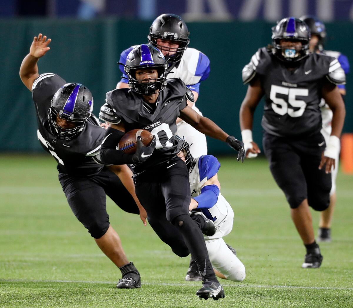 North Crowley running back Quinton Jackson (10) gains yardage up the middle during a high school 6A Division 2 bi-district football playoff game at Globe Life Park in Arlington, Texas, Friday, Dec. 11, 2020. North Crowley defeated Byron Nelson 23-16. (Special to the Star-Telegram Bob Booth)