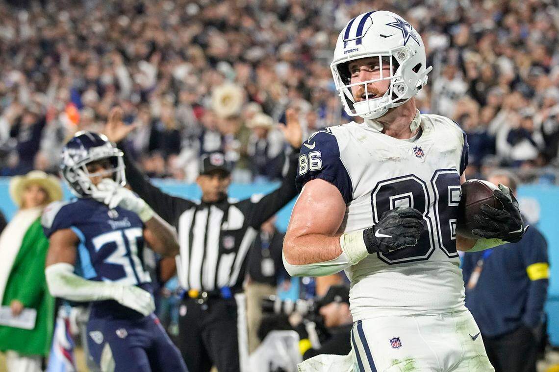 Dallas Cowboys tight end Dalton Schultz (86) runs into the end zone after a catch for a touchdown against Tennessee Titans cornerback Tre Avery (30) during the second half of an NFL football game, Thursday, Dec. 29, 2022, in Nashville, Tenn. (AP Photo/Chris Carlson)