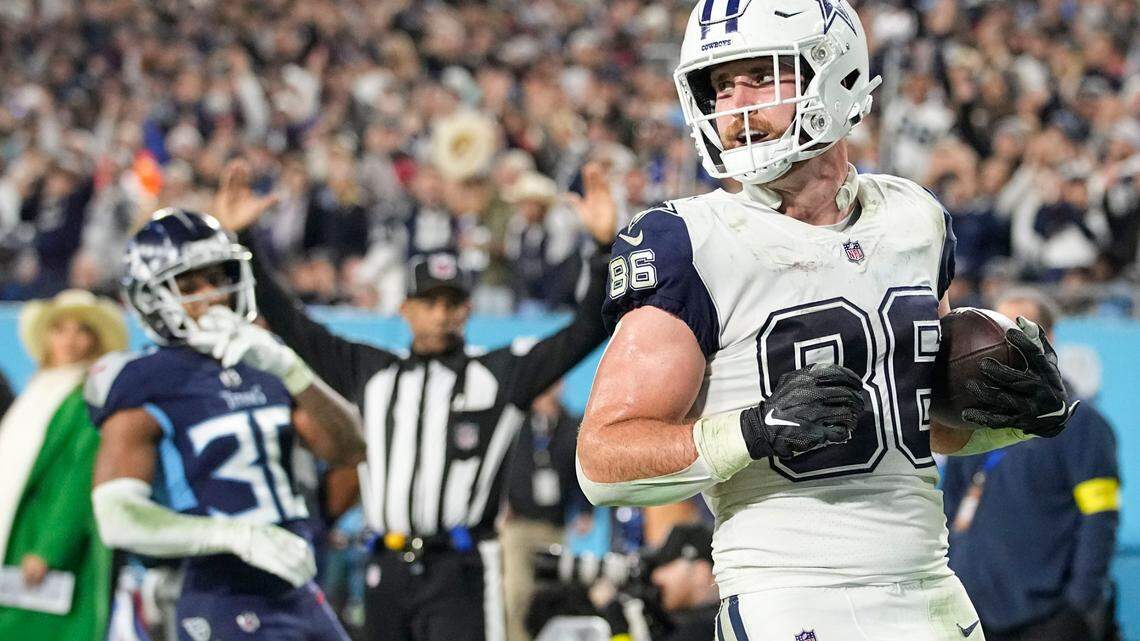 Dallas Cowboys tight end Dalton Schultz (86) runs into the end zone after a catch for a touchdown against Tennessee Titans cornerback Tre Avery (30) during the second half of an NFL football game, Thursday, Dec. 29, 2022, in Nashville, Tenn. (AP Photo/Chris Carlson)