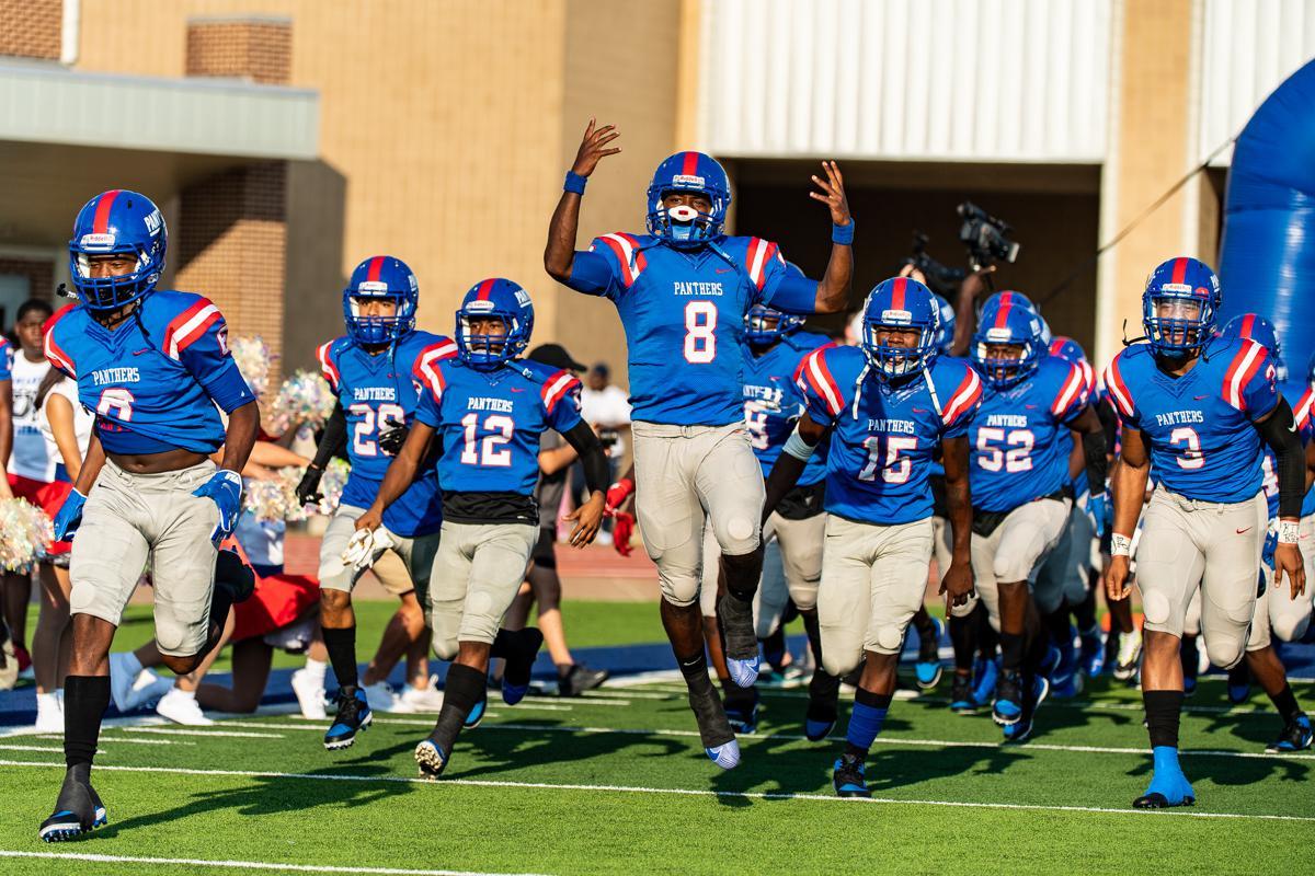 The Duncanville Panthers running onto the field.