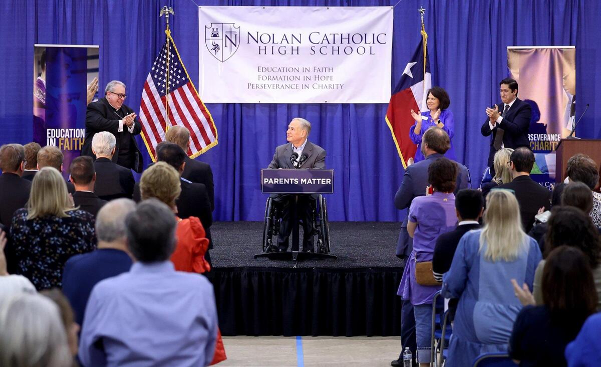 Gov. Greg Abbott receives a standing ovation after speaking at Nolan Catholic High School about his school choice plan on Wednesday, April 19, 2023. Senate Bill 8 would give families taxpayer money to pay for private schooling through an educational savings account