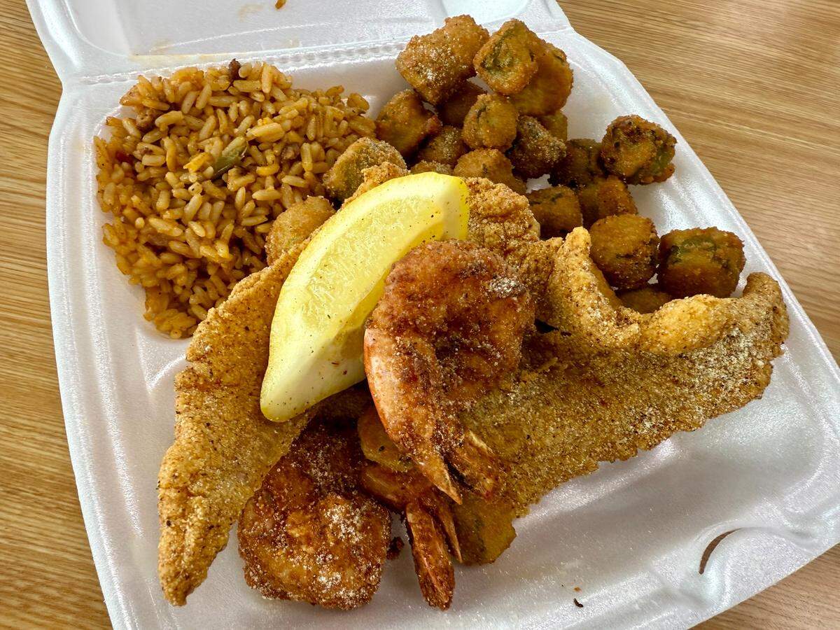 A catfish and shrimp combo with dirty rice and fried okra at Captain LA Fish Chicken and More in Arlington, Texas, as seen April 17, 2025.