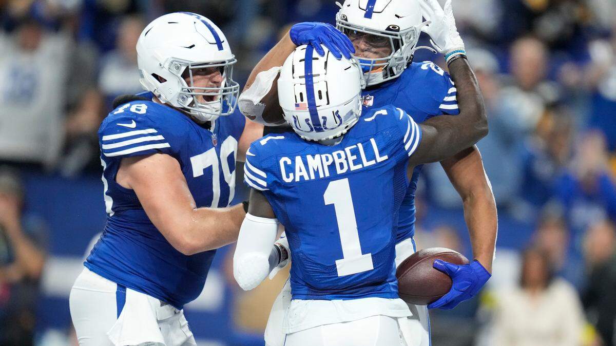 Indianapolis Colts’ Jonathan Taylor (28) celebrates a touchdown run with Parris Campbell (1) and Ryan Kelly (78) during the second half of an NFL football game against the Pittsburgh Steelers, Monday, in Indianapolis. (