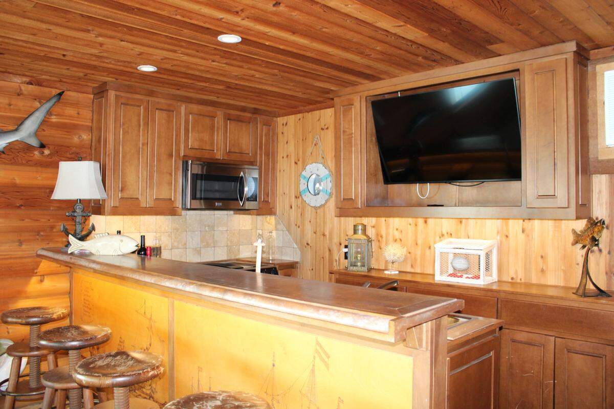 9930 Boat Club Road has a one-of-a-kind boat dock with kitchen and air conditioning.