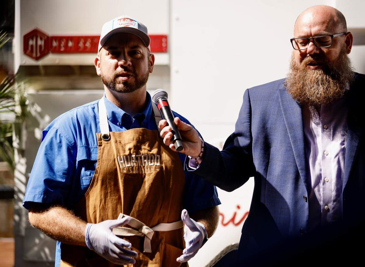 Brandon Hurtado, left, of Hurtado Barbecue in Arlington with Casey Rapp of concessions company Delaware North.