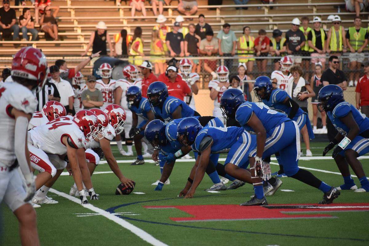 Ponder and Fort Worth Dunbar face off during a high school football game at Clark Stadium in Fort Worth, Texas.