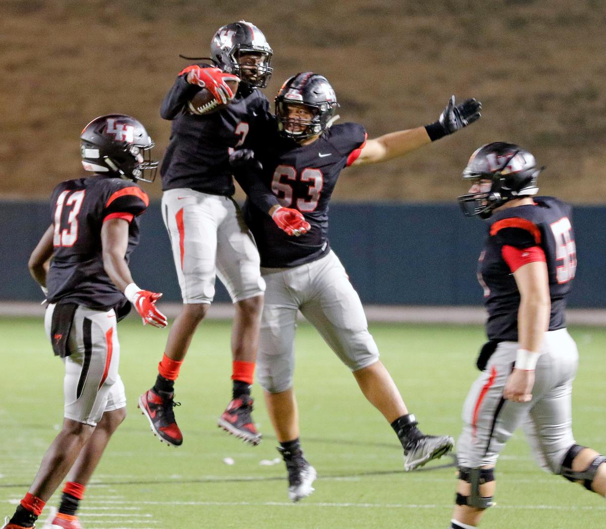 Lake Highlands linebacker Jeremiah Richards (3) and lineman JC Johnson (63 celebrate Richards fumble recovery in the second half of a high school bi-district football playoff game at the Gopher-Warrior Bowl in Grand Prairie, Texas, Friday, Nov. 15, 2019. A scoreless second half led to Lake Highlands defeating Mansfield Summit 35-19. (Special to the Star-Telegram Bob Booth)