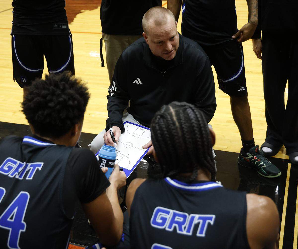 Brewer head coach Jason Porostovsky talks to the team during a timeout against Aledo in the first half of a UIL boys basketball game at Aledo High School in Aledo, Texas, Friday Feb. 13, 2026.