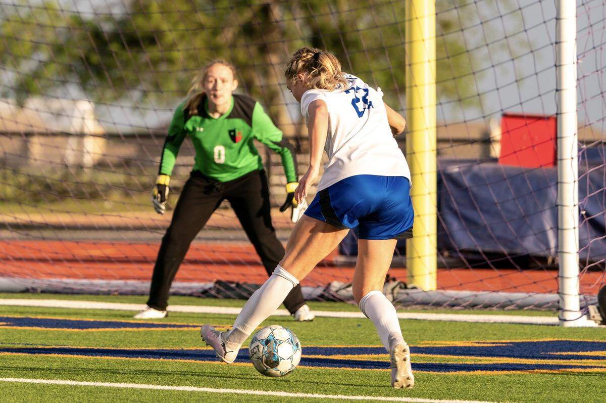 Joshua’s Maddy Bourzikas lines up for a short-side goal against Caitlyn Brown of Justin Northwest in a Class 5A area-round girls soccer match on Friday, March 29, 2024 at Boswell High School in Fort Worth ,Texas. Bourzikas finished with two goals in Joshua’s 4-1 win.