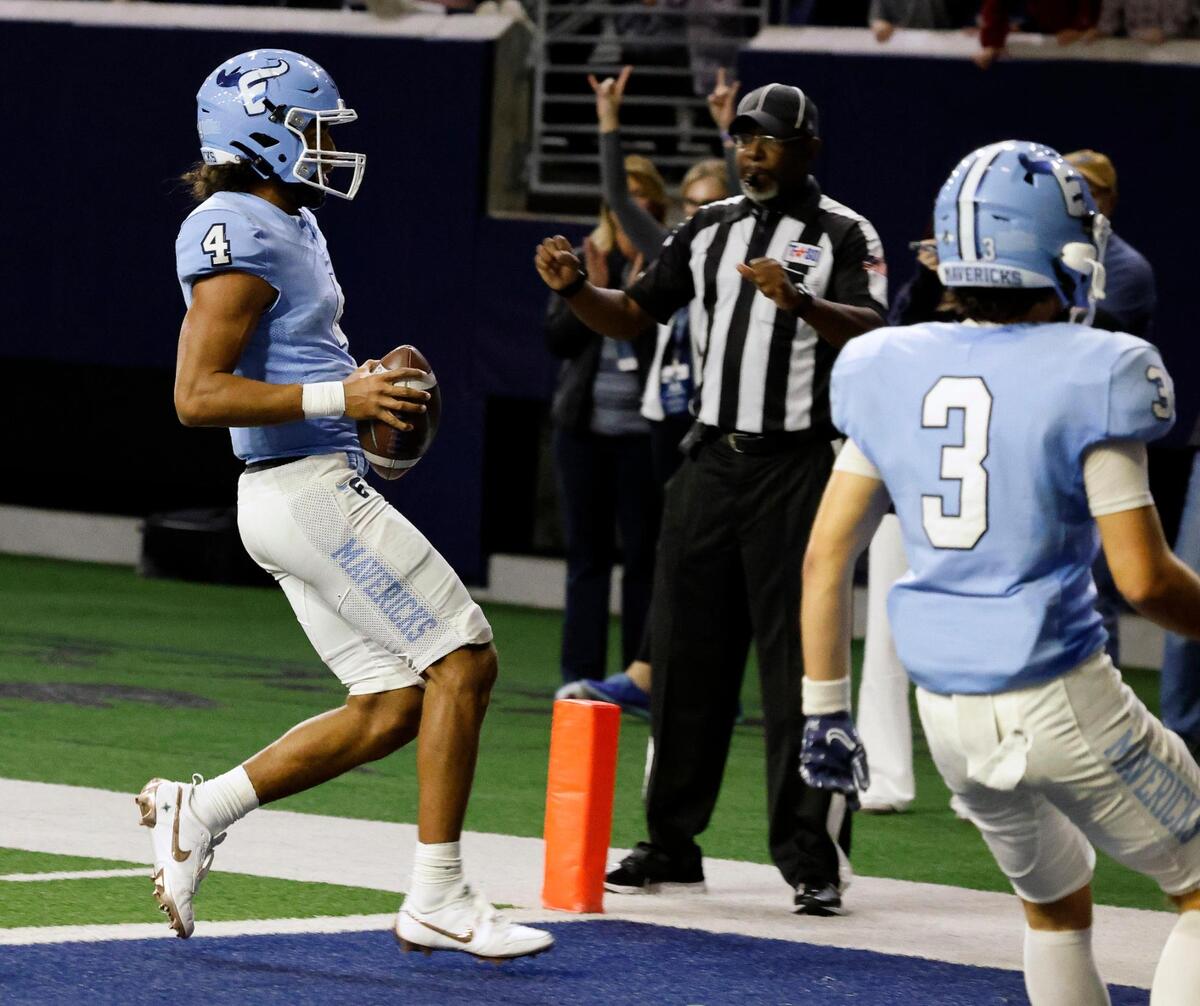 Emerson quarterback Michael Hawkins (4) steps across the Mavericks third touchdown during the first half of a UIL Conference 5A Division 2 quarterfinal football playoff game at The Ford Center in Frisco, Texas, Friday, Dec. 01, 2023.